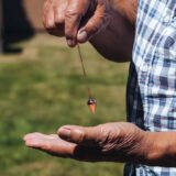 The Intuitive Navigator - Copper Pendulum reinhard holding
